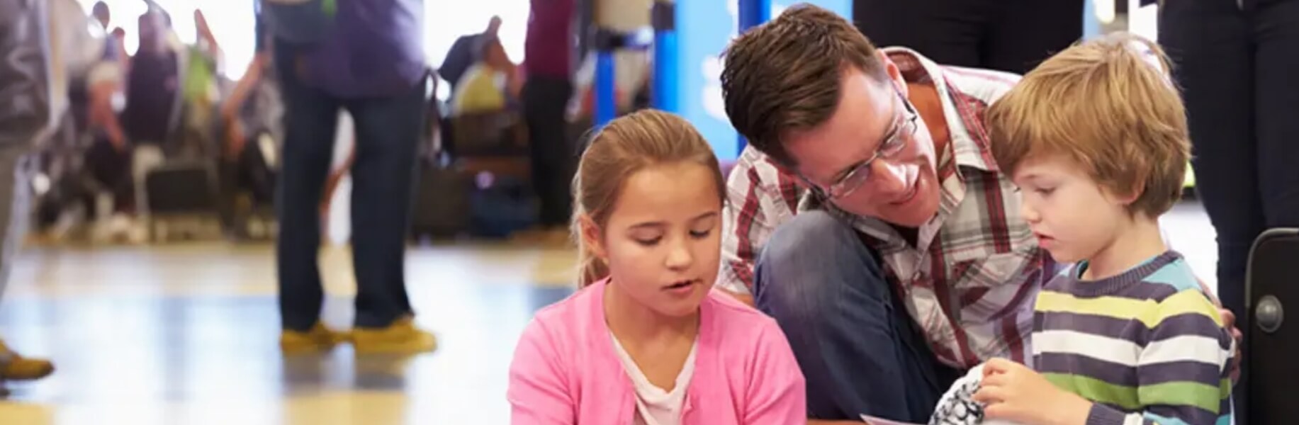 A caregiver speaks to his children
